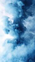 Swirling blue smoke creates an ethereal atmosphere in a dreamy, abstract background suitable for various creative projects photo