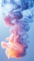 Colorful smoke swirls rise gracefully against a serene blue backdrop, creating an ethereal atmosphere in the composition photo