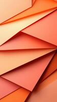 Colorful arrangement of overlapping paper sheets in shades of orange and peach at a crafting workspace photo