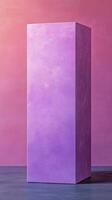 Tall purple geometric shape stands against a colorful background with soft gradients photo