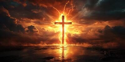 Powerful sunset lighting up a cross silhouette in a dramatic sky full of clouds and light photo