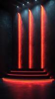 Bright red neon lights illuminate a modern stage set against a dark backdrop for performances photo