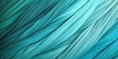 Vibrant teal and aqua threads creating a beautiful gradient pattern in a textile design photo