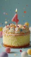 Bright and colorful birthday cake with four candle on top surrounded by festive decorations photo