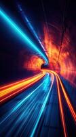 Bright lights illuminate a swirling tunnel with vibrant colors at night photo