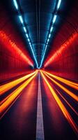 Vibrant light trails illuminate a tunnel during nighttime drive photo
