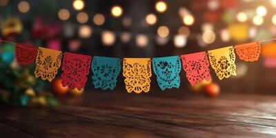 Colorful papel picado decorations create a festive atmosphere in a warm celebration setting during nighttime photo