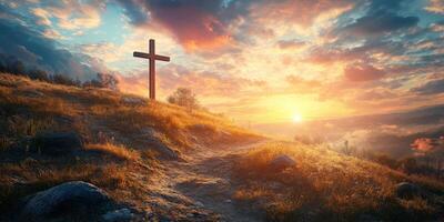 Sunrise over a hill with a wooden cross and vibrant clouds illuminating the landscape photo