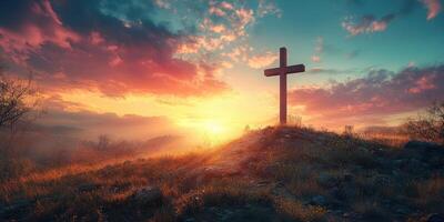 Cross silhouetted against a vibrant sunset in a tranquil landscape photo