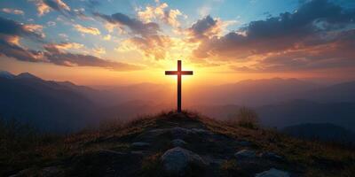 Sunset over mountains with a silhouette of a cross in a serene landscape photo