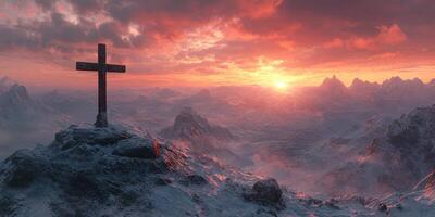 Mountain landscape at sunset with a cross overlooking snow-covered peaks photo