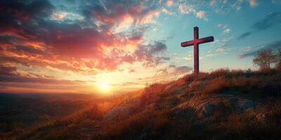 Sunset view over a hill with a wooden cross overlooking a vibrant sky and landscape in the early evening photo
