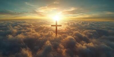 Sunrise illuminates a cross above clouds, symbolizing hope and faith in the sky photo