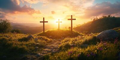 Three crosses stand majestically on a hillside at sunset, surrounded by vibrant greenery and tranquil landscapes photo