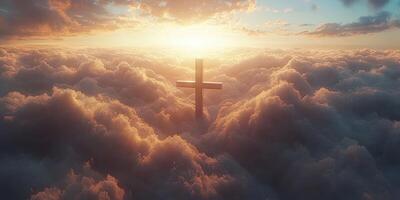 Spiritual sunrise over clouds with a cross illuminated by soft morning light photo