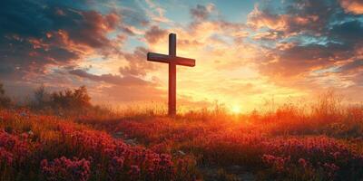Sunset over a cross in a tranquil meadow filled with vibrant flowers and colorful clouds photo