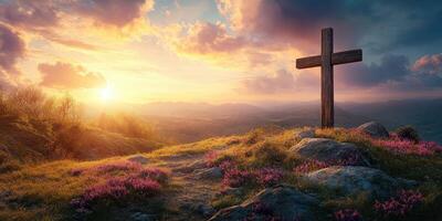 Sunset view over a hill with a wooden cross surrounded by wildflowers in a serene landscape photo