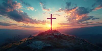 Cross on a hilltop against a stunning sunset with dramatic clouds over a serene landscape photo