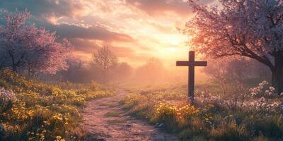 Tranquil pathway through a blossoming field at sunset with a wooden cross in the foreground photo