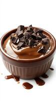 Rich chocolate mousse topped with chunks of dark chocolate in a bowl with melted chocolate drizzling down the sides photo