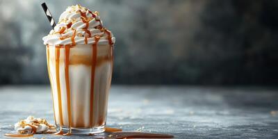 Delicious caramel milkshake topped with whipped cream and drizzled with syrup on a rustic table photo