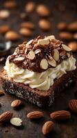 Delicious dessert toast topped with whipped cream, chocolate, and almonds on a rustic wooden table photo