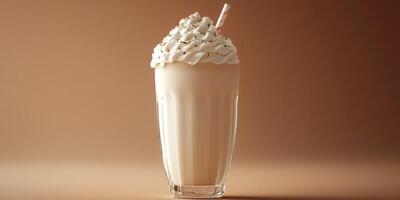 Creamy milkshake topped with whipped cream served in a tall glass with a straw on a warm background photo