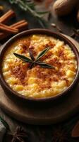 Creamy dessert featuring rice pudding topped with cinnamon and spices served in a wooden bowl photo