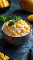 Delicious coconut mango rice pudding served in a rustic bowl with fresh mint at a cozy kitchen setting photo