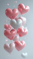 Colorful hearts floating in the air create a whimsical display of love and affection in a serene setting photo