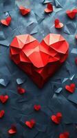 Colorful paper heart artwork surrounded by smaller hearts on a textured blue background photo