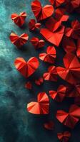 Creative display of red origami hearts on a textured teal backdrop for celebration or decoration photo