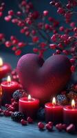Romantic decor featuring heart-shaped centerpiece and candles amid red flora for an intimate setting photo