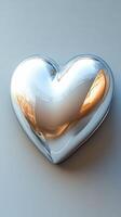 Sleek metallic heart sculpture reflecting light in a minimalist setting photo
