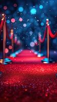 Red carpet walkway illuminated by sparkling lights and surrounded by velvet ropes in an elegant setting photo