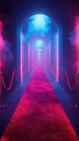 Bright lights illuminate a vibrant corridor with red carpet and fog at an event venue photo
