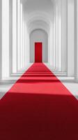 Elegant red carpet leading to a vibrant door in a white architectural corridor surrounded by arches photo
