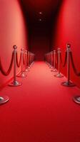 Red carpet corridor with velvet ropes creates an elegant entrance to a glamorous event at night photo