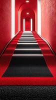 Red and black staircase leading to bright arches in a modern building with focused lighting creating a striking ambiance photo