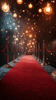 Red carpet walkway leading to an event venue with sparkling lights in the background photo
