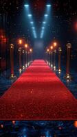 Red carpet leading to a spotlight area surrounded by glowing lights and barriers at an evening event photo
