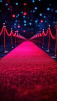 Luxurious red carpet leading to a glamorous event venue with colorful bokeh lights in the background photo