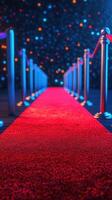 Elegant red carpet leading to a dazzling event venue with bright lights and velvet ropes in the evening atmosphere photo