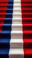 Red, white, and blue carpet staircase design featuring bold color blocks in a vibrant pattern photo
