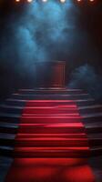 Illuminated podium on a dramatic stage with red carpet steps surrounded by fog and soft lighting photo