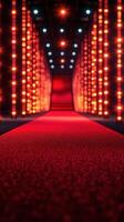 Vibrant red carpet runway with bright lights creating an energetic atmosphere for fashion events at night photo