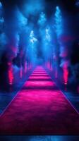 Illuminated pathway lined with fog and vibrant lights creates a dramatic atmosphere for an event photo