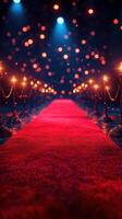 Bright red carpet pathway illuminated by warm lights, perfect for a glamorous event or award ceremony setting photo