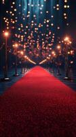 Elegant red carpet lined with lights leading to a luminous venue at night photo