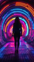 Colorful neon lights illuminate a tunnel as a silhouetted figure walks through vibrant hues at night photo